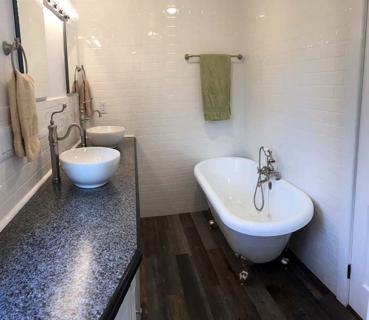 Subway Tile Bathroom Wood-Look Tile Floor Installation Claw Foot Tub Above Counter Sinks